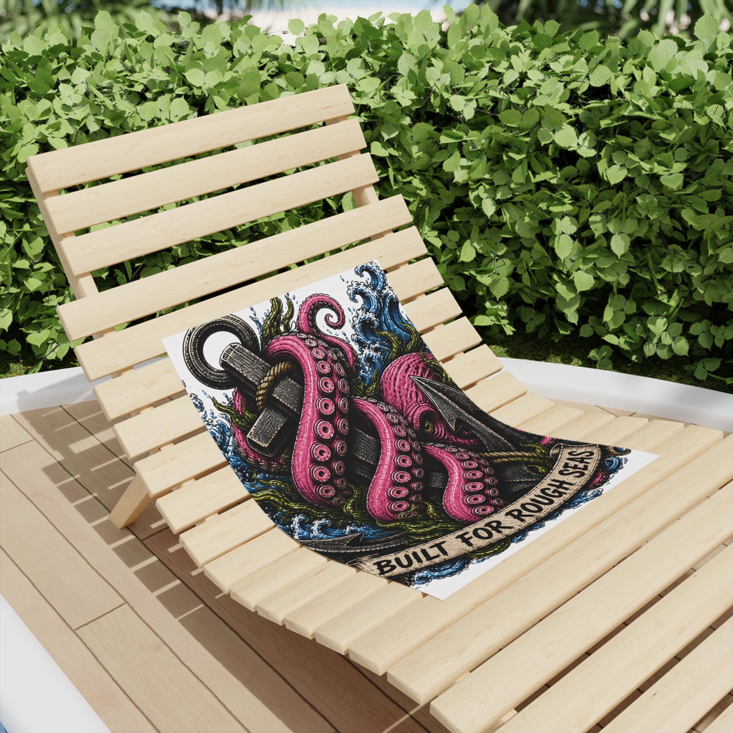 Nautical Kraken anchor beach towel on a wooden lounge chair, featuring a fuchsia octopus and 'Built for Rough Seas' design.