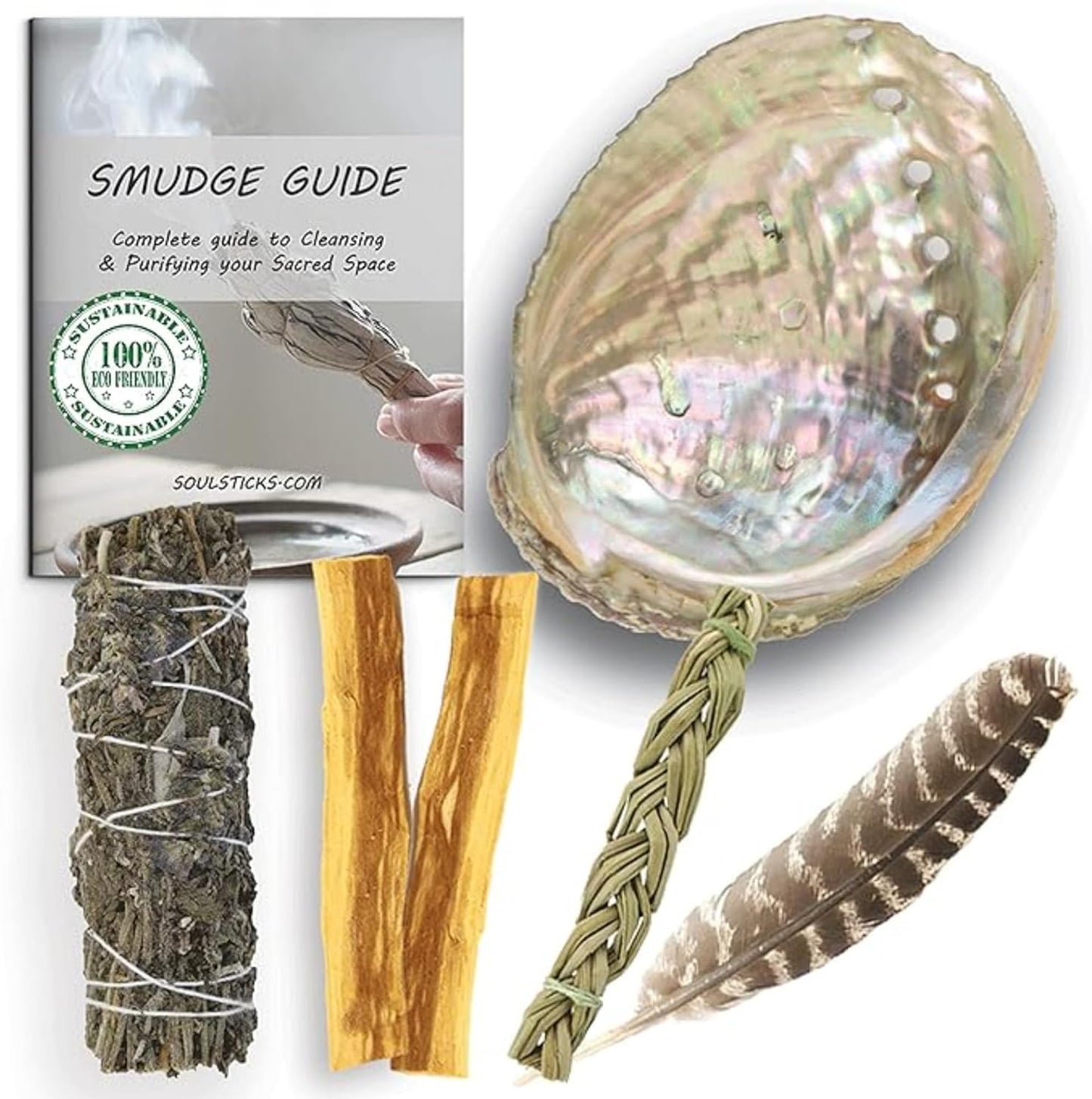 Dragon’s Blood sage smudge kit with abalone shell, Palo Santo sticks, sweetgrass braid, feather, and smudge guide.