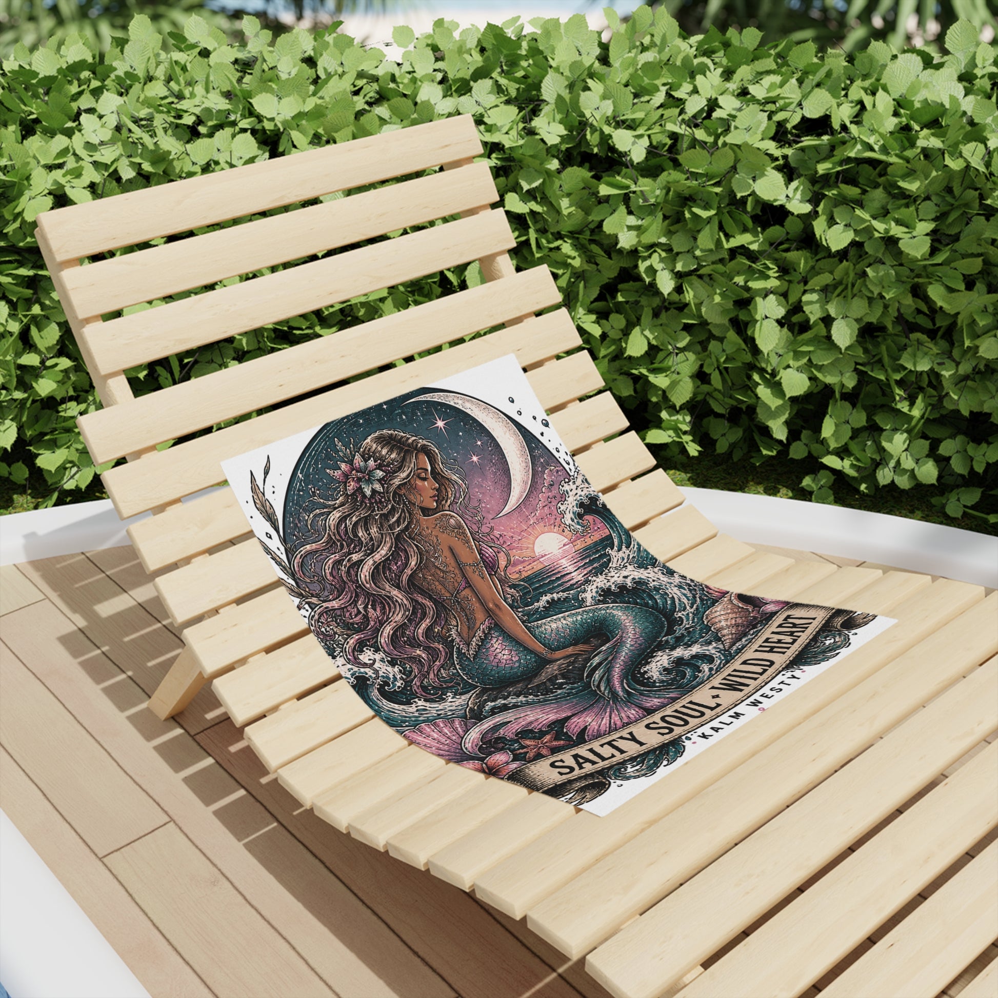 Vintage mermaid beach towel with Salty Soul Wild Heart text, displayed on a timber sun lounger outdoors.