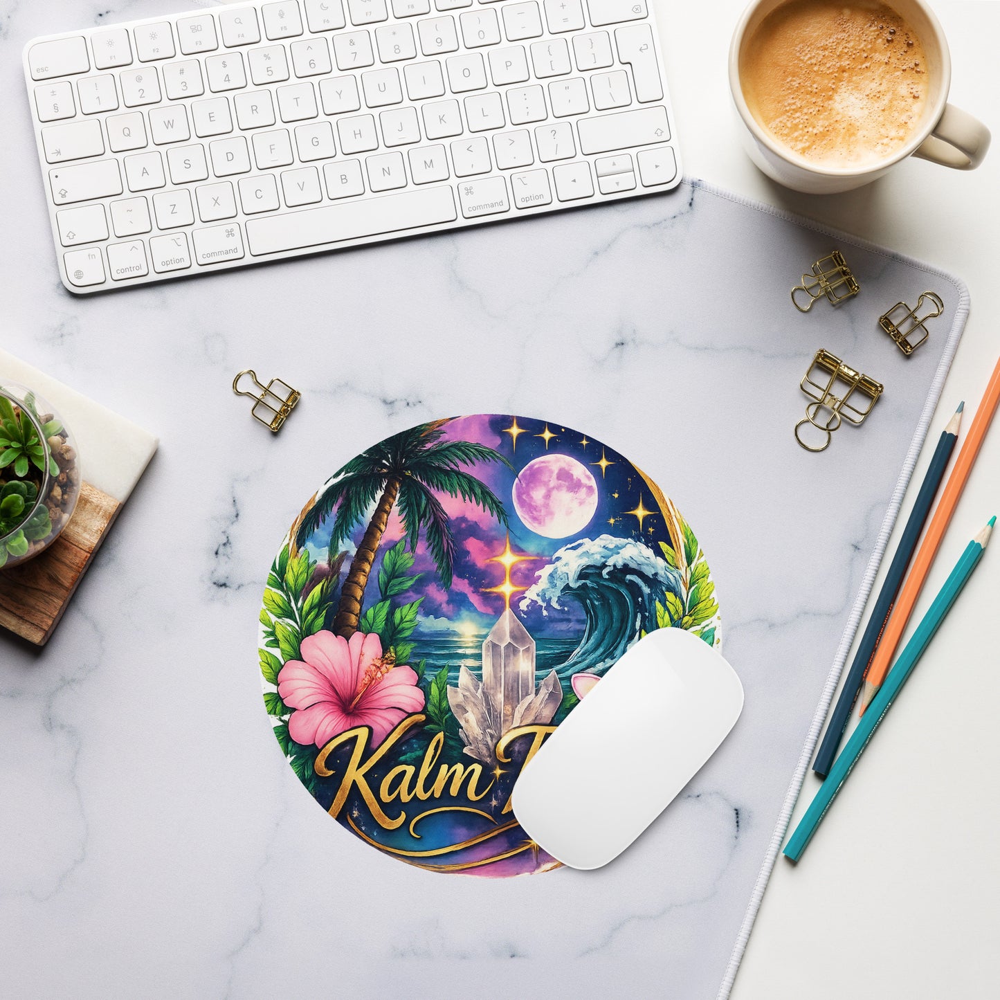 Round neoprene mouse pad with a tropical nature and crystal design on a white marble desk with a laptop keyboard.
